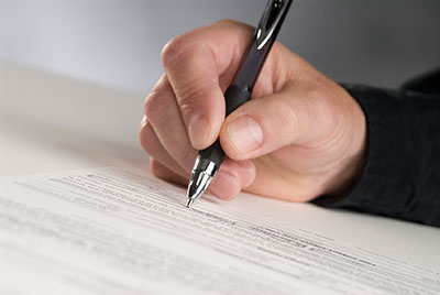 signing on paper