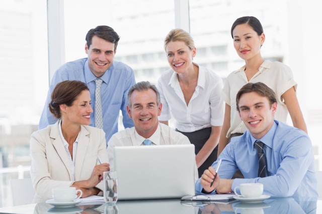 Employees Around Computer